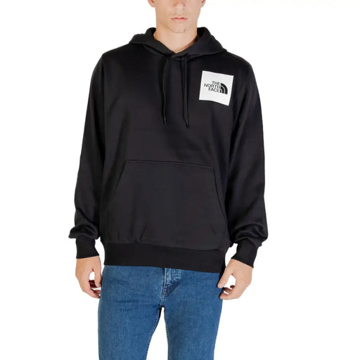 Men’s black hooded sweatshirt with front pouch pocket and white logo patch from The North Face