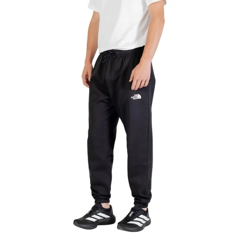 Men’s black sweatpants with white logo on left leg from The North Face Fall Winter collection