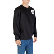Men’s black crewneck sweatshirt with white square logo patch from The North Face