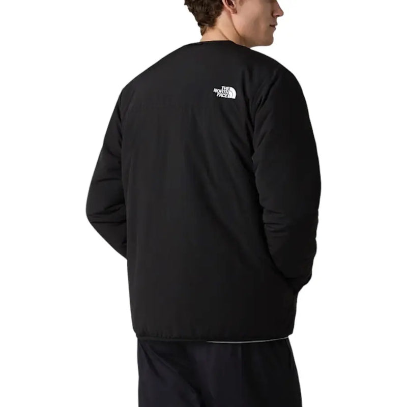 Blazer noir The North Face pour homme, en nylon, avec logo blanc au dos et fermeture éclair.