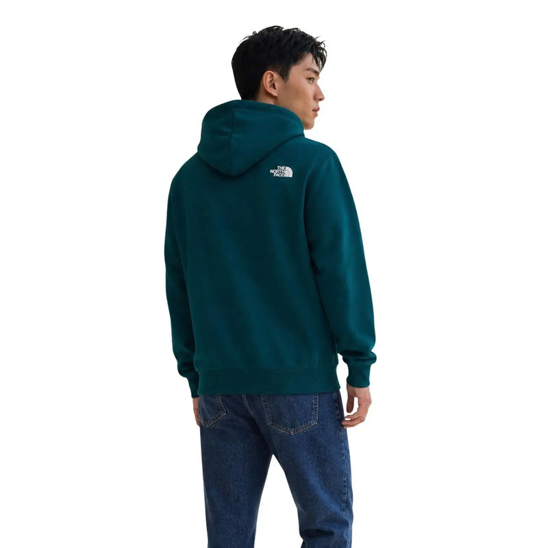 Sweat à capuche The North Face pour homme, en coton bleu sarcelle foncé, dos visible avec logo blanc en haut du dos.