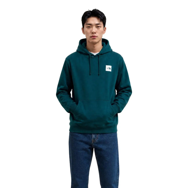 Sweat à capuche The North Face pour homme, en coton vert foncé, avec logo blanc sur la poitrine.