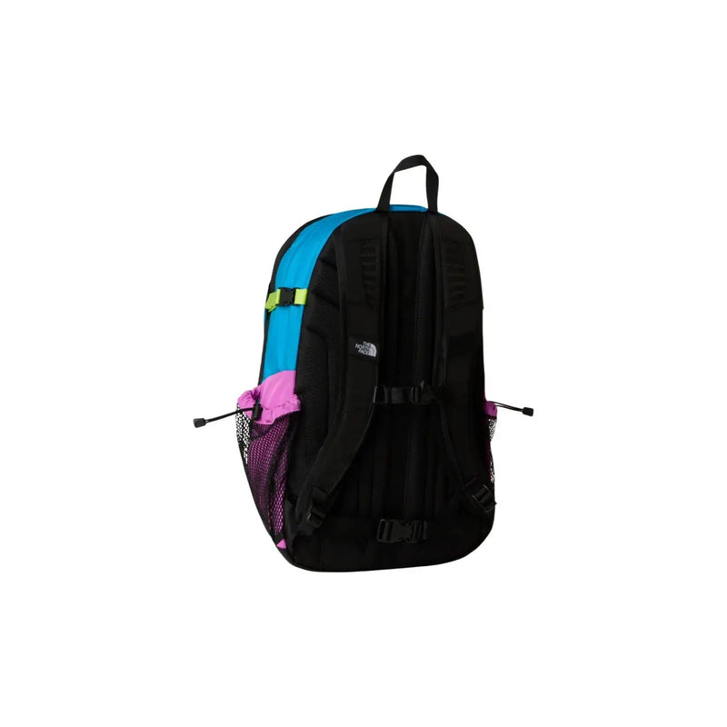 Sac à dos The North Face Hot Shot SE pour homme, en nylon violet avec corps noir et bleu, poches en filet rose et détails de sangle vert fluo