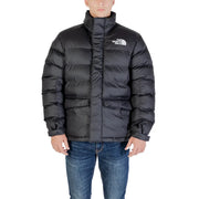 Veste The North Face pour homme, col roulé long en polyester noir, matelassée, avec logo sur la poitrine.