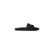 Pantoufles noires The North Face pour homme, avec bride en polyester texturé et logo blanc discret.