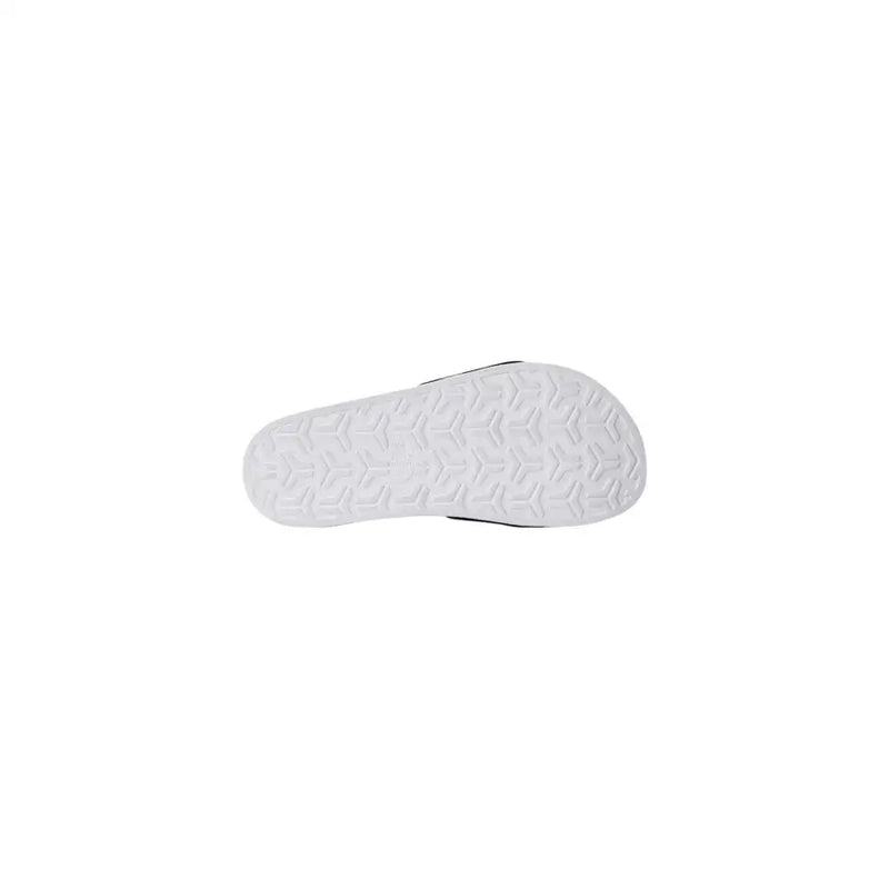 Les pantoufles pour homme The North Face, ornées d'un logo blanc, sont dotées d'une semelle en caoutchouc blanc à motif géométrique et de finitions noires.