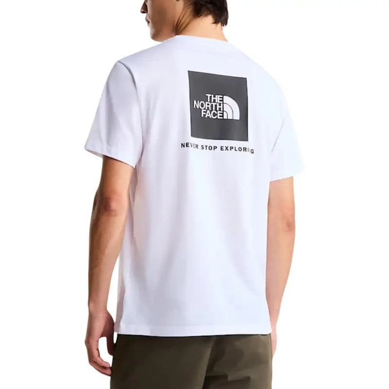 coton blanc à manches courtes t-shirt orné d'un logo carré noir avec le slogan « The North Face » et « Never Stop Explored »