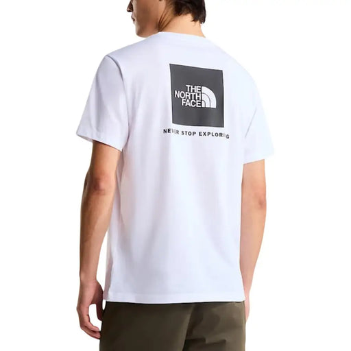 coton blanc à manches courtes t-shirt orné d'un logo carré noir avec le slogan « The North Face » et « Never Stop Explored »