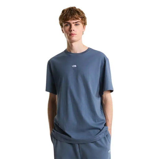 A navy blue short-sleeved cotton t shirt for men by The North Face with a small white logo on the chest