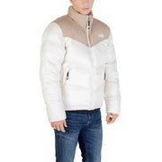 Beige and white north face puffer jacket with a high collar.