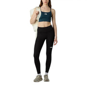 Legging noir taille haute avec logo blanc sur la cuisse gauche, en polyester et élasthanne, de la marque The North Face (pantalon femme).