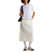 A cream-colored mid-thigh length skirt with relaxed fit and pleats paired with the north face women white cotton blend t shirt
