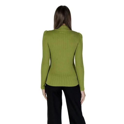 Olive green fitted blazer with long sleeves viewed from behind over B.young T-shirt
