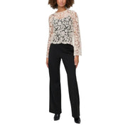 Delicate ivory lace top with floral embroidery, long sleeves, paired with Only black polyester trousers for women