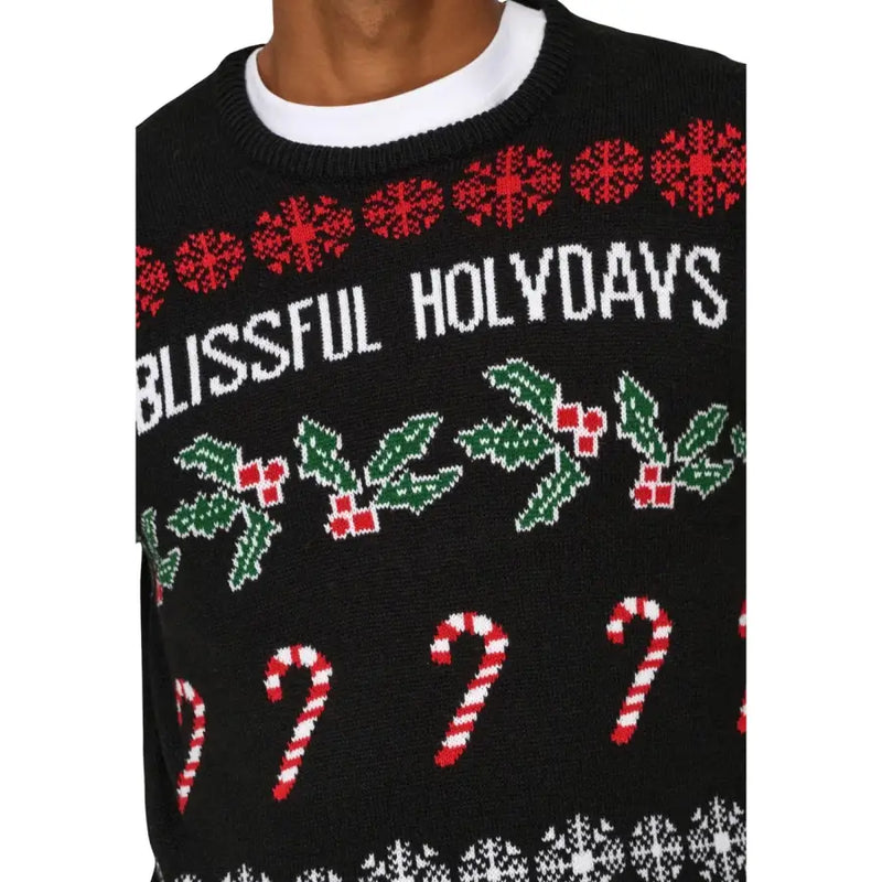 Only Pull de Noël noir en acrylique pour homme, tricoté avec des flocons de neige rouges, du houx vert et un imprimé de cannes de Noël.