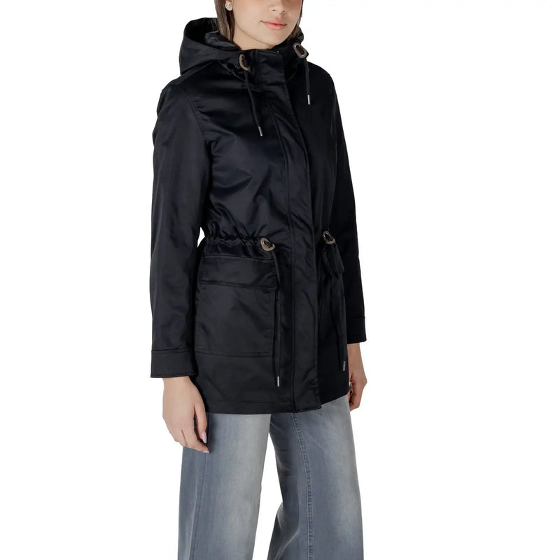 Black polyester long blazer with hooded raincoat design, front zipper, drawstring hood, and silver-toned pocket accents