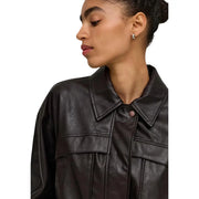 Only Women black faux leather jacket with structured collar and front flap pockets in classic long design