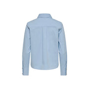 Only women light blue cotton long polo shirt with classic collar and subtle pleats shown from the back side