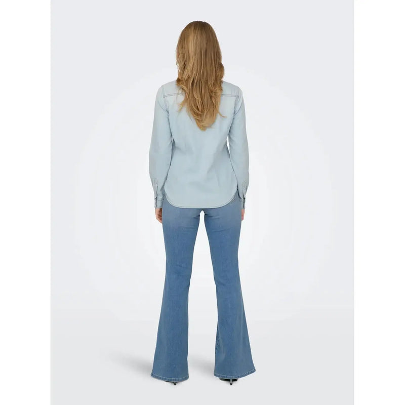 Light-wash denim flared pants with a classic tapered fit paired with an Only women long light blue cotton button shirt
