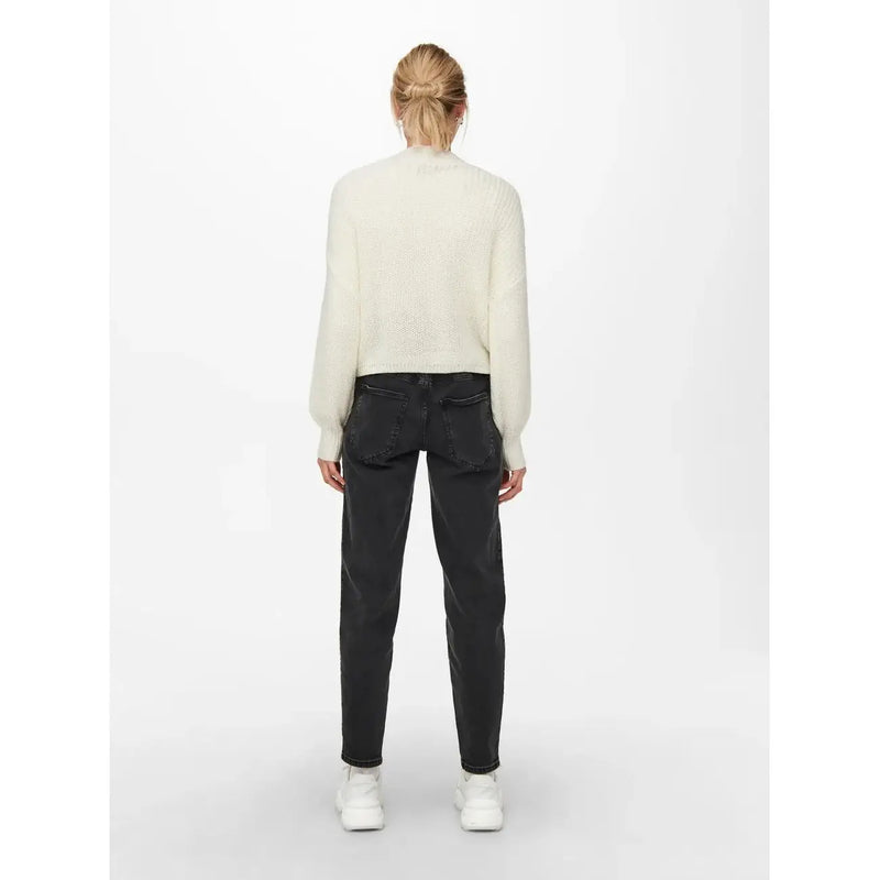 Cream-colored long-sleeved knit sweater with textured pattern featuring v neck and button detail in acrylic material