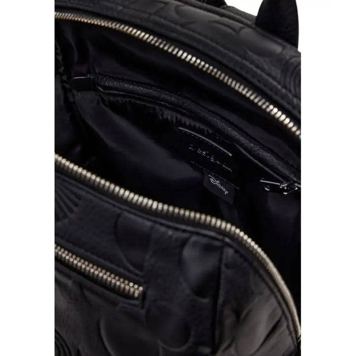 Open black leather Mickey Mouse backpack with silver zippers for stylish storage