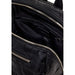 Open black leather Mickey Mouse backpack with silver zippers for stylish storage
