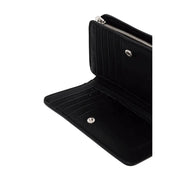 Black leather open wallet from Calvin Klein displaying card slots and cash compartment