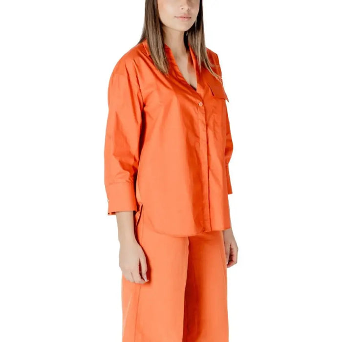 Orange collared shirt and matching pants set displayed in the Orange Shirt and Pants Set product image