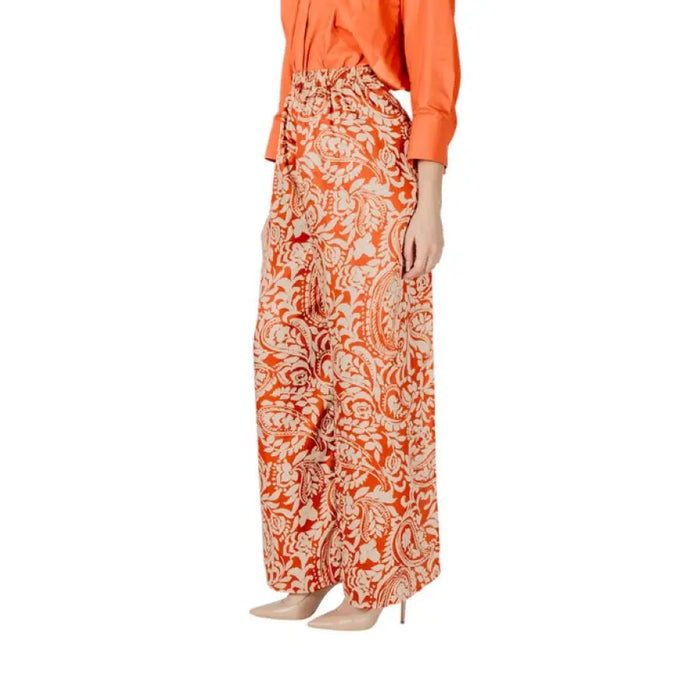 Orange paisley print palazzo pants featured in Floral Patterned Orange Pants collection