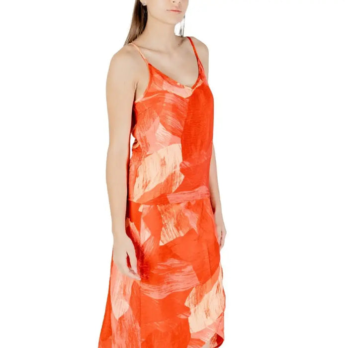 Orange patterned slip dress with spaghetti straps from the Orange Abstract Print collection