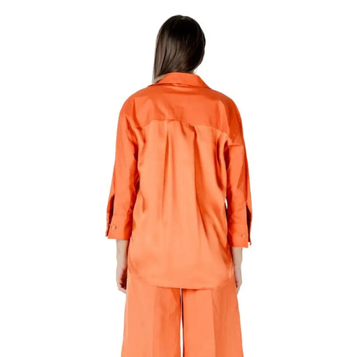 Orange shirt and pants set displayed in the Orange Shirt and Pants Set product image