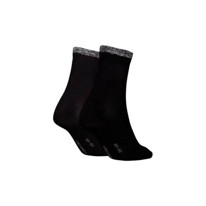 Pair of black Calvin Klein socks with gray trim for stylish comfort and versatility