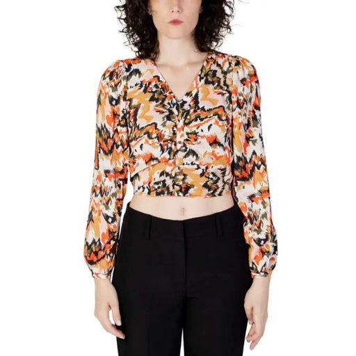 Patterned long-sleeve crop top in vibrant orange for Women’s Fall Winter collection