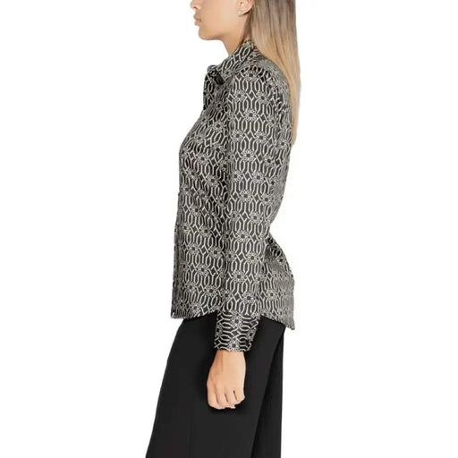 Patterned turtleneck blouse featuring black and white geometric print from Rinascimento
