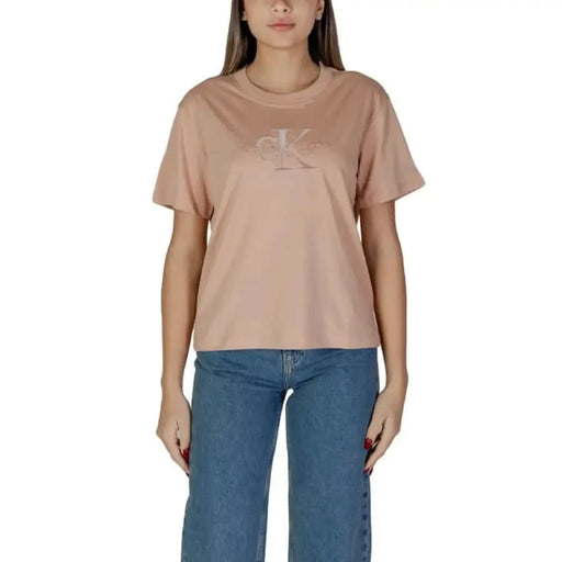 Peach Calvin Klein t-shirt featuring monogram logo for women with round neck design