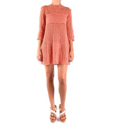 Peach-colored crochet mini dress displayed on a mannequin for the Peach Crocheted Mini Dress product