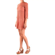 Peach-colored crocheted mini dress displayed in the Peach Crocheted Mini Dress product image