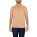 Peach short-sleeved button-up shirt for men by Hamaki-ho, paired with dark pants