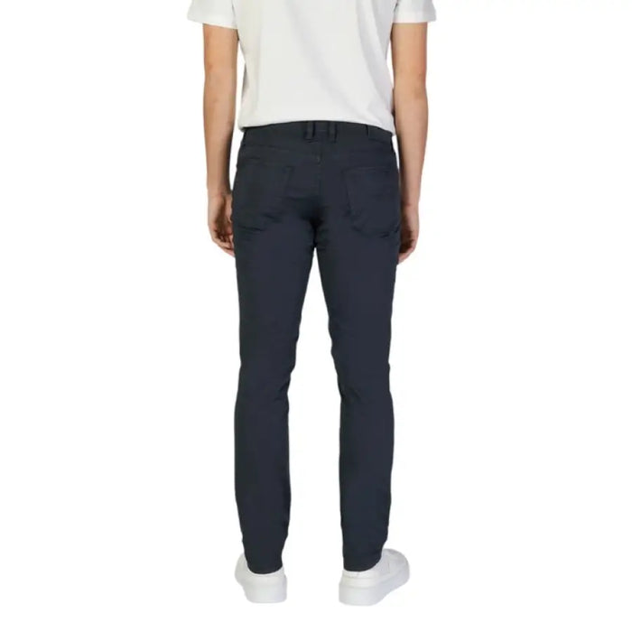 Person showcasing Jeckerson Mens Blue Cotton Trousers in dark blue pants