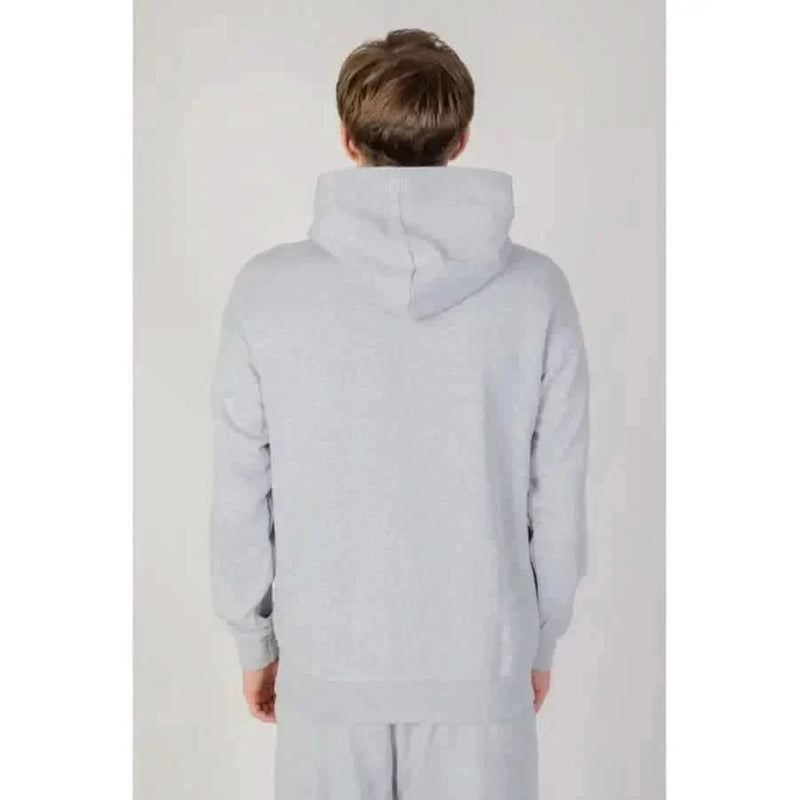 Man in grey Underclub hoodie showcasing urban city style fashion