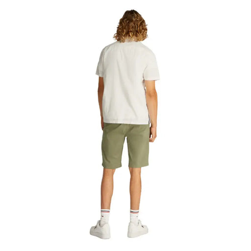 Man modeling a casual summer outfit with a t-shirt and shorts for Men’s Summer Collection