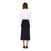 Person in a white long-sleeved top and black skirt from Jacqueline De Yong collection