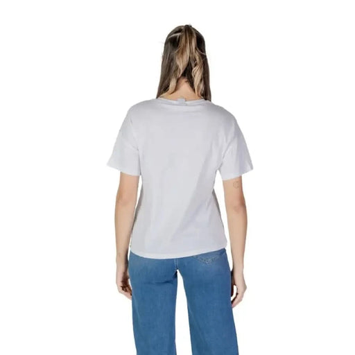 Person wearing Liu Jo Women’s White Cotton Round Neck T-Shirt and blue jeans from behind