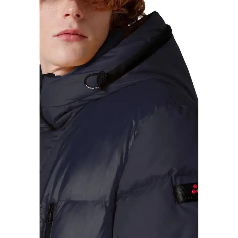 Navy blue down jacket with hood and red logo patch on sleeve.