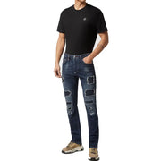 Jean Philipp Plein pour homme, bleu, en coton déchiré, effet usé, avec empiècements bleu foncé délavés et logo brodé.