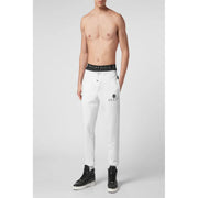 Pantalon de jogging blanc Philipp Plein pour homme, avec ceinture noire et logo brodé sur la jambe.
