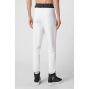 Pantalon de jogging blanc Philipp Plein pour homme, avec ceinture élastique noire ornée du logo et bandes latérales assorties.