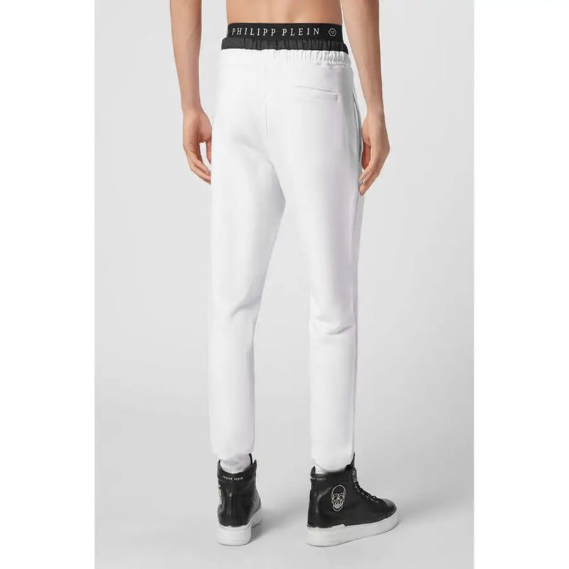 Pantalon de jogging blanc Philipp Plein pour homme, avec ceinture élastique noire ornée du logo et bandes latérales assorties.