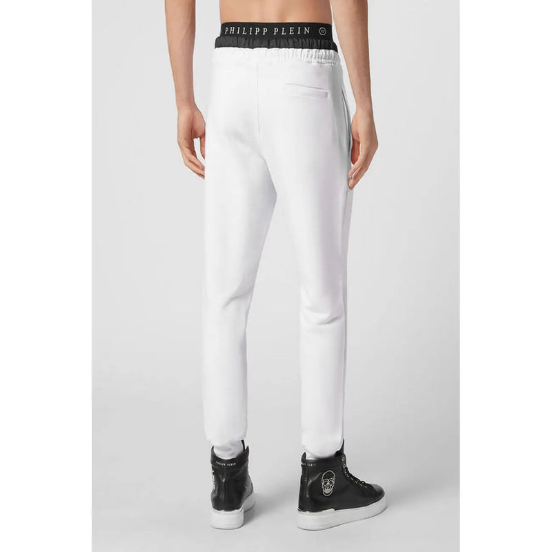 White Philipp Plein men joggers with black elastic waistband featuring logo and matching side stripes