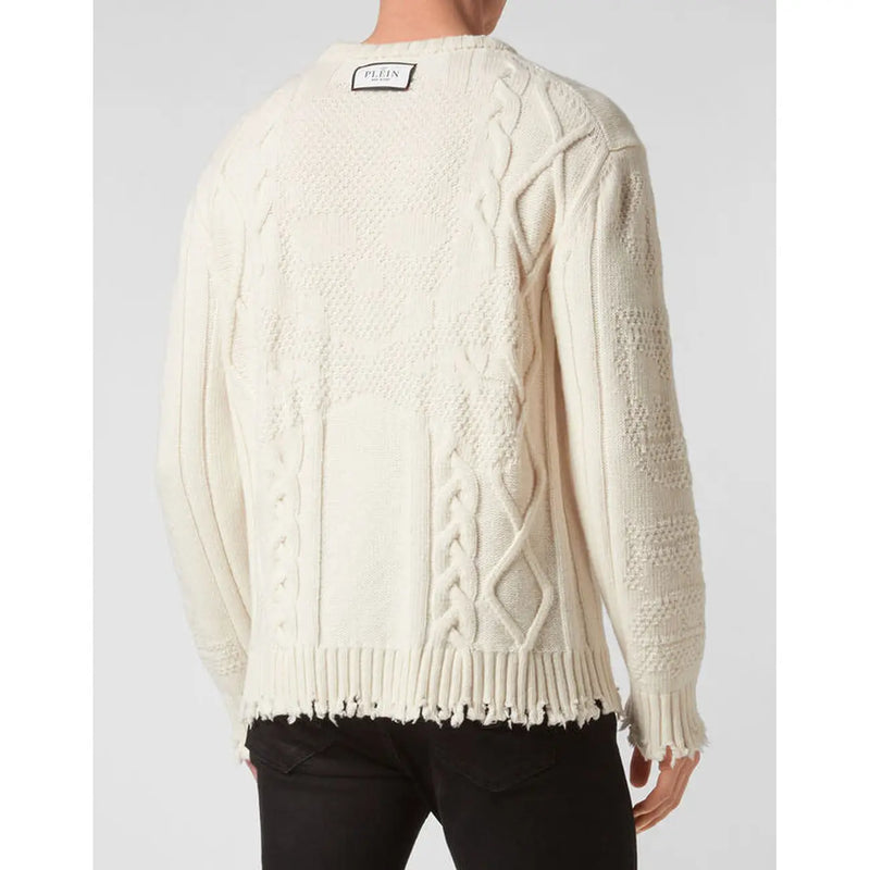 Pull Philipp Plein en laine couleur crème pour femme, à maille torsadée, ourlet et poignets effilochés (vue de face)